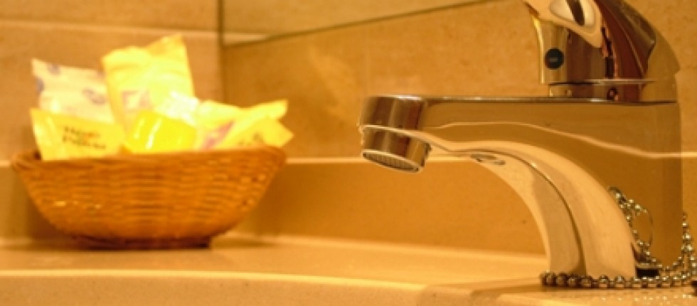 Bathroom with bathtub, wardrobe, luggage rack furniture, air conditioning and heating.