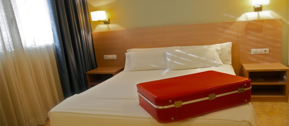 Bathroom with bathtub, wardrobe, luggage rack furniture, air conditioning and heating.